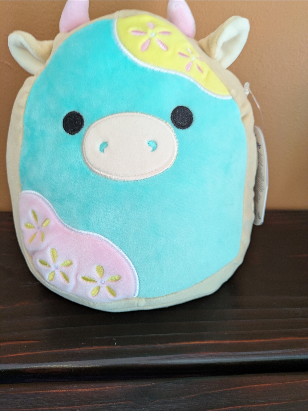 Plush Teal Animal Stuffed Toy with Pink and Yellow Accents